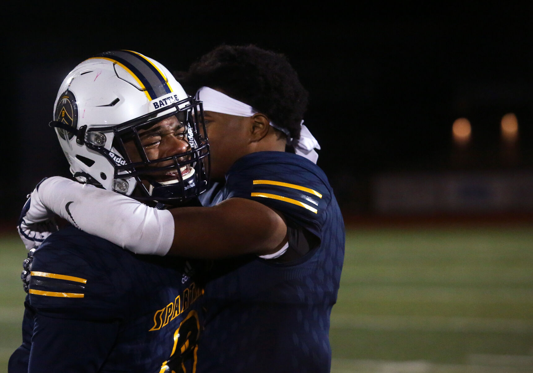 Battle senior Kendrick Perkins cries while being hugged by Battle senior Jarrett Lambert